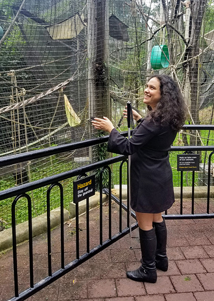 Lindsay Yazallino visits a gibbons exhibit.